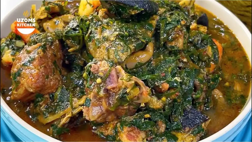 Bowl of ofe owerri with assorted meats and vegetables