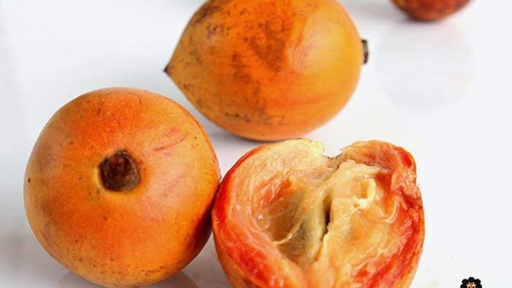 Fresh agbalumo fruit cut in half