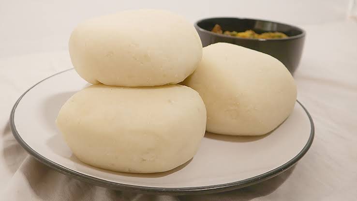 Swallow fufu served with Nigerian egusi soup
