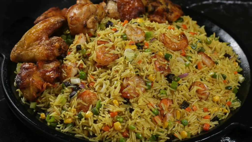 Nigerian fried rice served with fried chicken