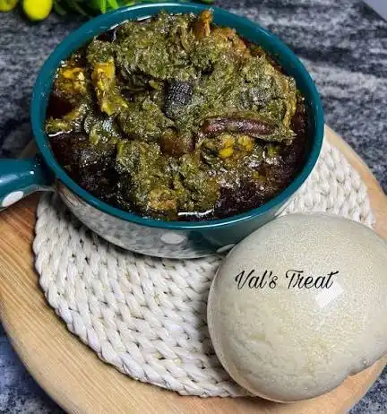 Bowl of afang soup with pounded yam