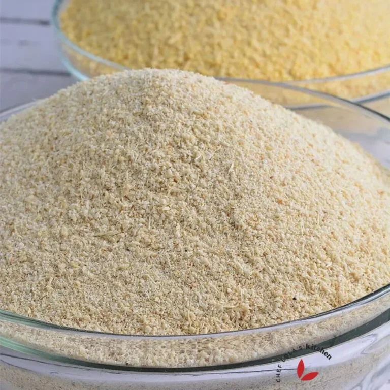 White and yellow garri flakes side by side in bowls