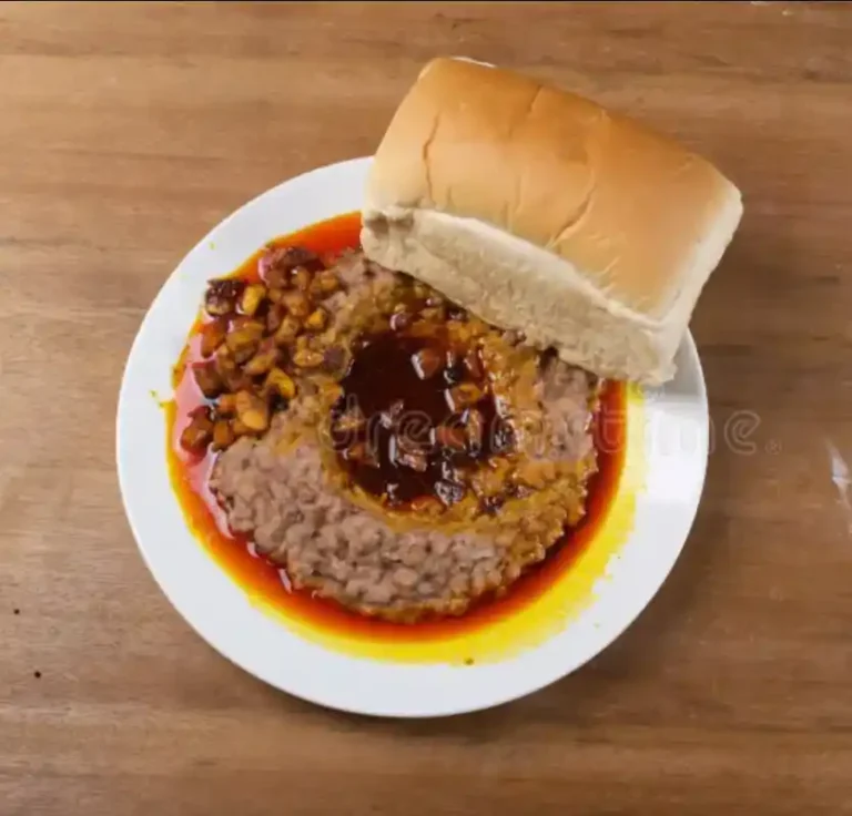 ewa agoyin served with bread and fried plantain"