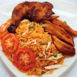 jollof rice served with grilled chicken and fried plantain