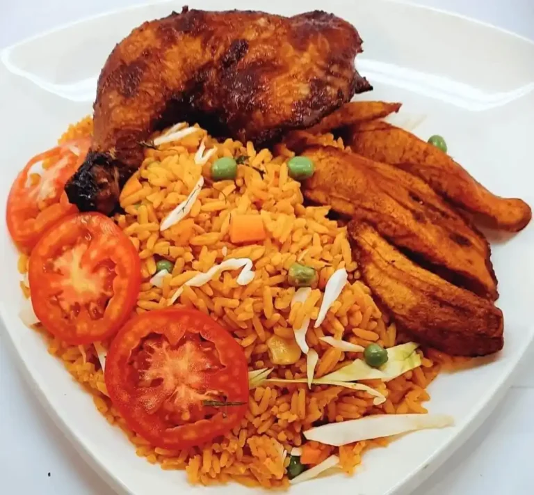 jollof rice served with grilled chicken and fried plantain