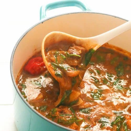 ogbono soup stretching from a spoon
