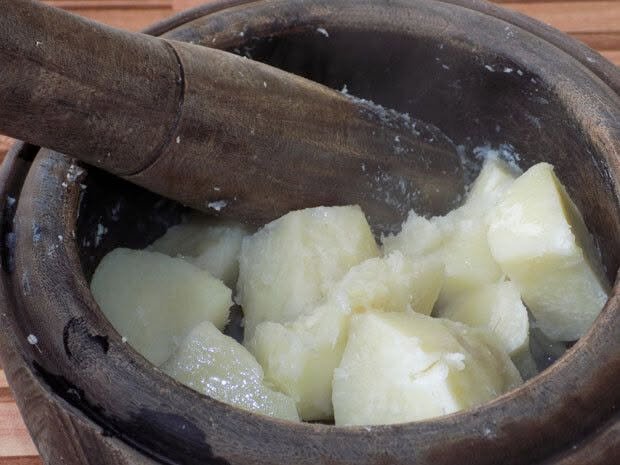 yam tubers being boiled for pounding